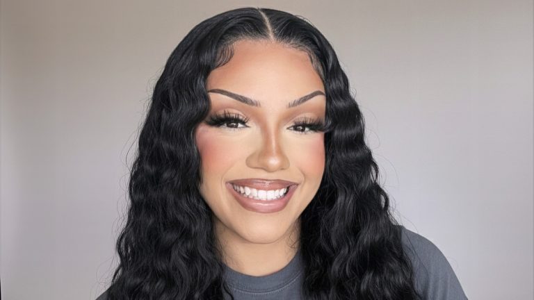 Headshot of Bre Johnson. She has dark skin, long dark hair, and is wearing a grey t-shirt.